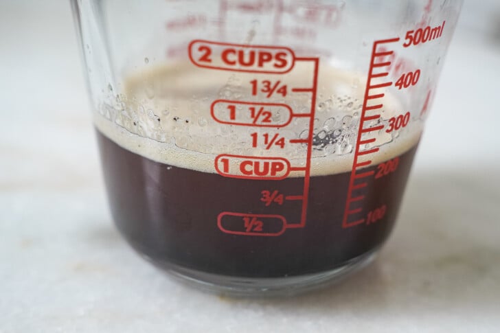 browned butter in a measuring cup