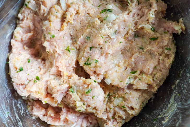 ground chicken mixture in a bowl to make meatballs