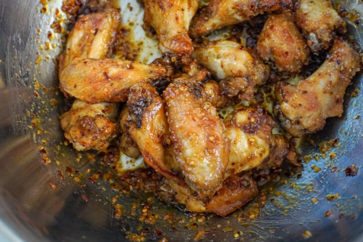 chicken wings with a chili lime sauce in a bowl
