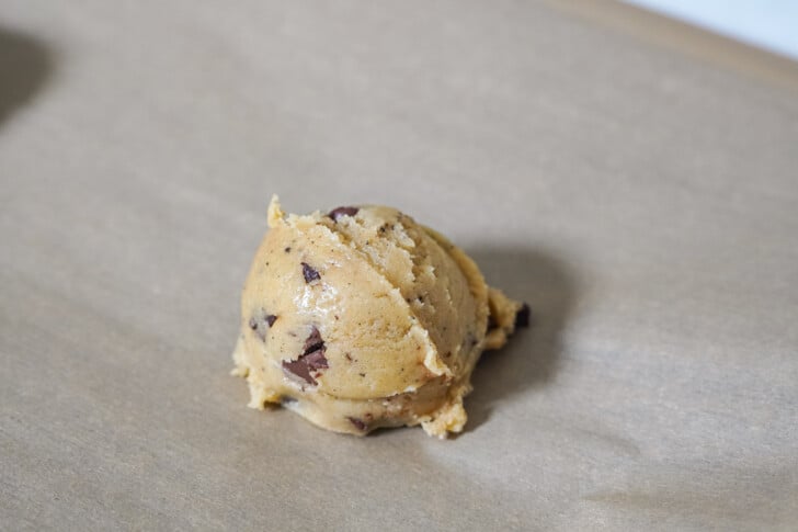 a scoop of cookie dough on a sheet pan