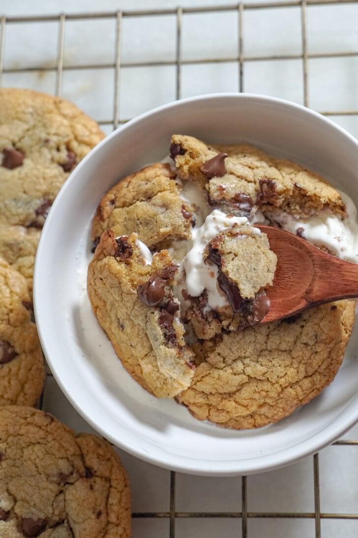 chocolate chip cookie in a bowl over vanilla ice cream
