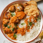 meatballs in butter chicken sauce in a bowl