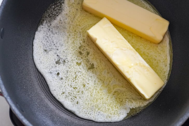 2 sticks of butter in a skillet melting